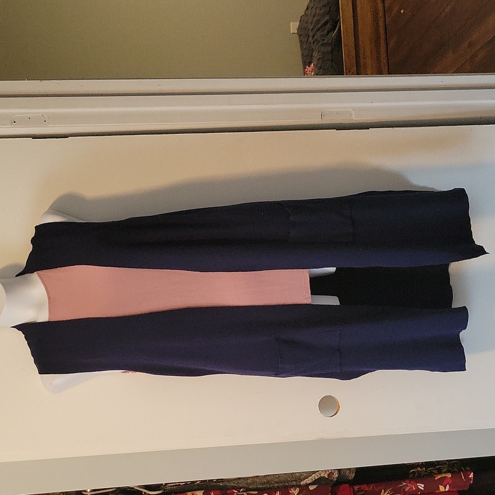 Navy blue extra long knit vest. Mid weight material. Pockets in front